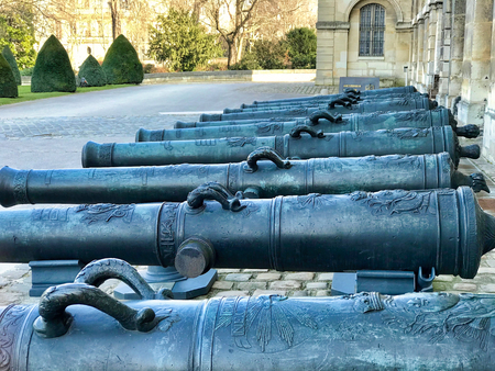 PARIS - FEBRUARY 24, 2018: group of cannons  in the entrance courtyard  of les invalides in Paris. The National Residence of the Invalids and Army Museumのeditorial素材