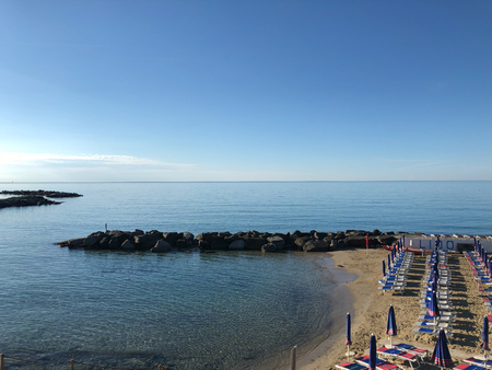 empty beach in San Remo at sunrise in a beautiful sunny day, Italy