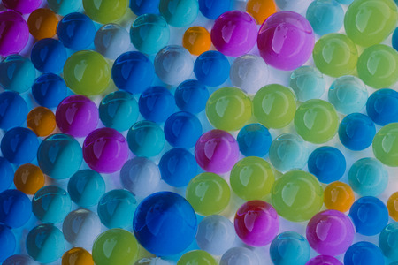 large group of  multicolor hydrogel balls on white backgroundの写真素材