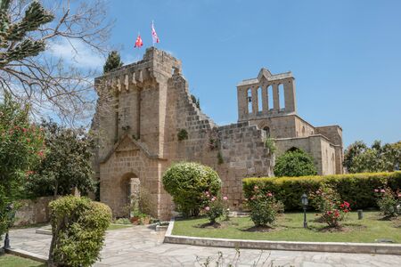 Kyrenia, Turkish Cyprus - May 5, 2019:  trees and flowers near Bellapais Abbey a masterpiece of Gothic art and architecture of the thirteenth centuryのeditorial素材