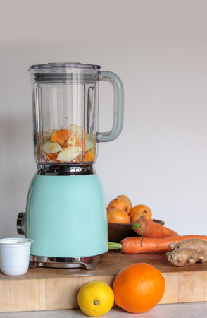 blender ready to prepare fruit and vegetable smoothies in the kitchenの写真素材