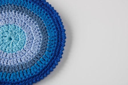close up of handmade crochet pot holder in blue shades, copy spaceの写真素材