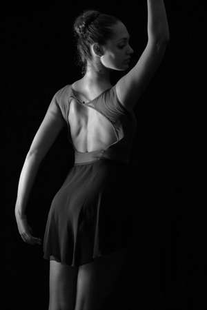 female dancer back in ballet position, black and white