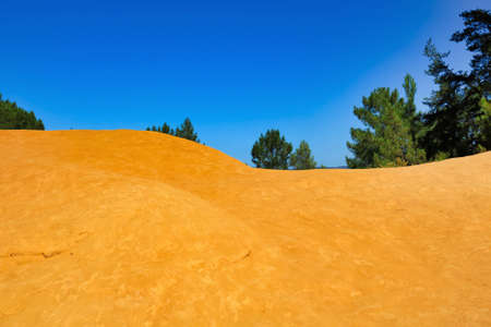 yellow clay and blue sky in a summer day, Roussillon France