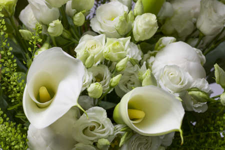 bouquet of white pure flowers with green decorationの写真素材