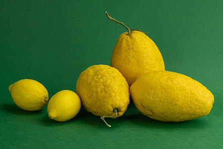 group of yellow citrus isolated on green backround