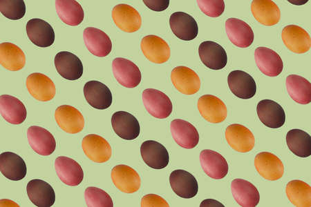 multicolored pattern with easter painted eggs on pistachio background, full frameの写真素材