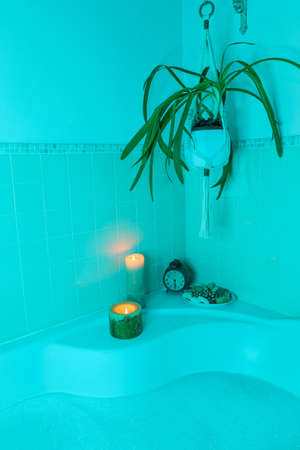 relaxing corner in bathroom for a bath in the tub, cyano light