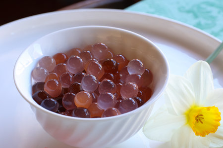 group of gelly spheres obtained by inverse spherification in white cupの写真素材