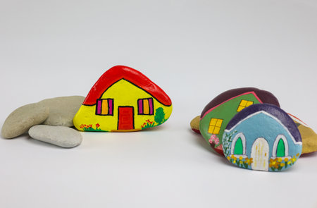 selective focus on yellow home painted on stone isolated on white background, copy spaceの写真素材