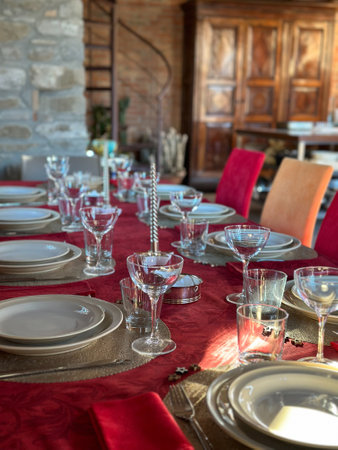 beautiful table setting with christmas decoration in living roomの写真素材