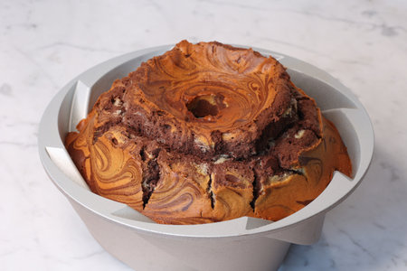 close view of marbled cake texture with vanilla and cocoa on marble backgroundの写真素材