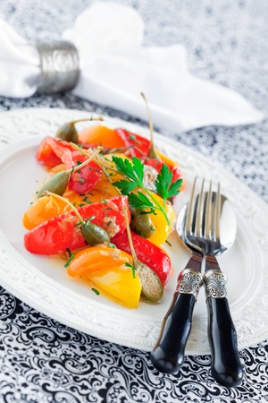 Italian stewed peppers with capers and anchovies, selective focus の写真素材