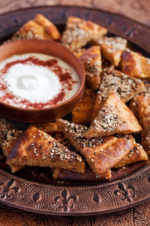 Sliced ââzaatar flatbread and yogurt sauce. Selective focusの写真素材