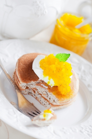 Oat pancakes with orange marmalade, selective focusの写真素材