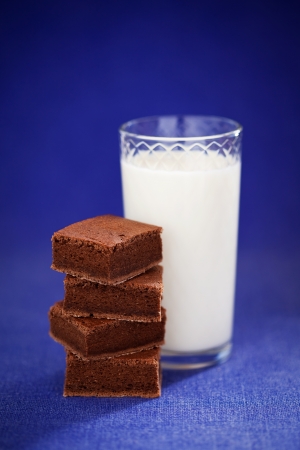 Chocolate brownie and glass of milk, selective focusの写真素材