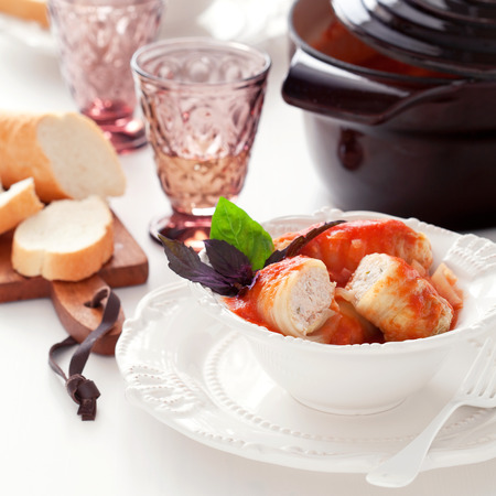 Stuffed cabbage rolls with chicken and rice in tomato sauce, selective focusの写真素材