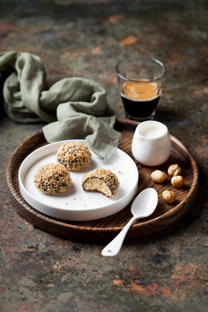 Homemade almond shortbread cookies (Snowball) with cocoa and hazelnuts, selective focusの写真素材