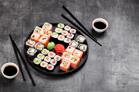 Sushi rolls set served in round plate, selective focusの写真素材