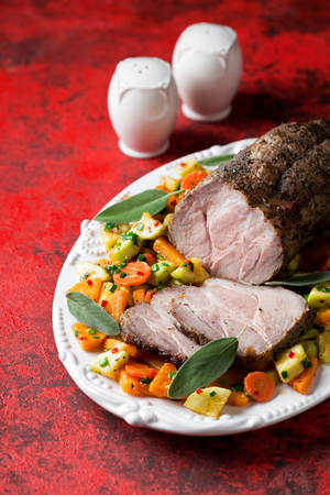 Baked pork meat with vegetables, selective focusの写真素材
