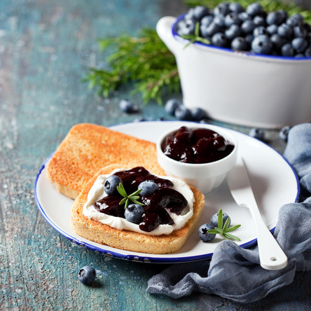 Toast with cream cheese and blueberry jam, selective focusの写真素材