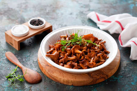 Fried wild edible chanterelle mushrooms, selective focusの写真素材