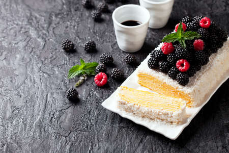 Napoleon cake with lemon cream and berries, selective focus