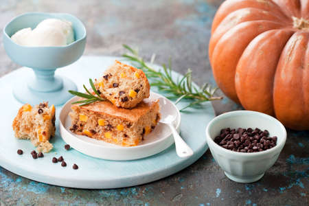 Homemade paleo cassava flour slice cake with pumpkin and chocolate chips, selective focusの写真素材