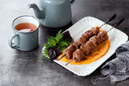 Grilled meat on skewers and eggs keto flat bread, selective focusの写真素材