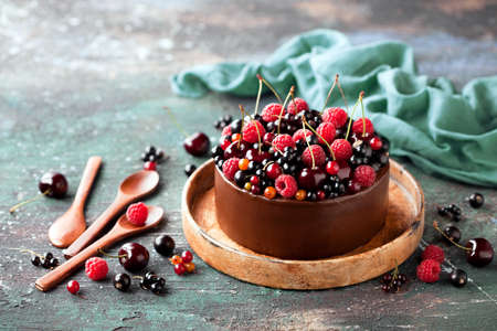 Chocolate cake with fresh berries, selective focusの写真素材