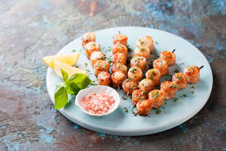 Bacon wrapped scallops skewers, selective focusの写真素材
