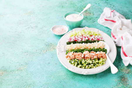 Healthy Cobb salad with salmon on a plate, selective focusの写真素材