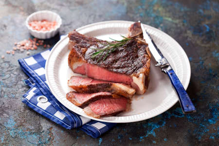 Grilled cowboy steak or rib eye sliced on a plate, selective focusの写真素材