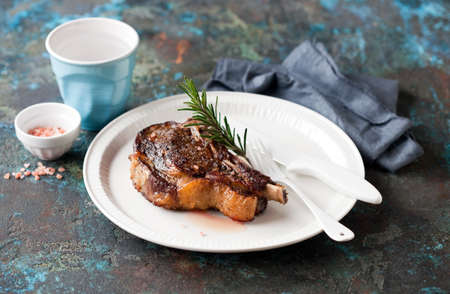 Grilled cowboy or rib eye steak on a plate, selective focusの写真素材