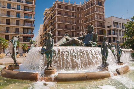 Valencia, Spain - 07/21/2019: A Fountain - Neptune surrounded by eight naked women -  allegoric representation of Valenciaâs Turia River and its eight irrigation ditches - Plaza De La Virgenのeditorial素材
