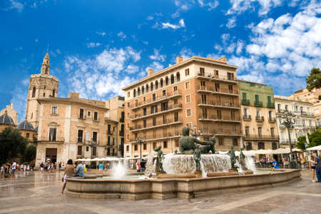 Valencia, Spain - 07/24/2019: A Famous El Miguelete Tower and NeptuneÂ´s Fountain, La Plaza De La Virgen.のeditorial素材