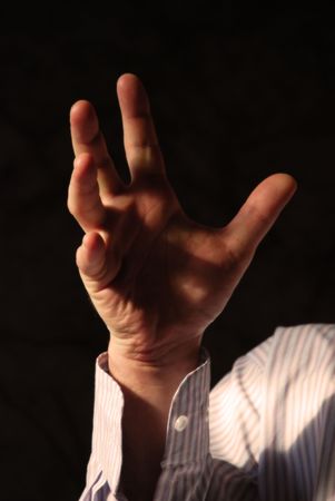 Strong man's hand with thumbs up. White shirt in stripes.の写真素材
