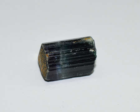 Tourmaline gem crystal raw on whiteの写真素材