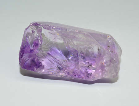 Amethyst gemstone on white