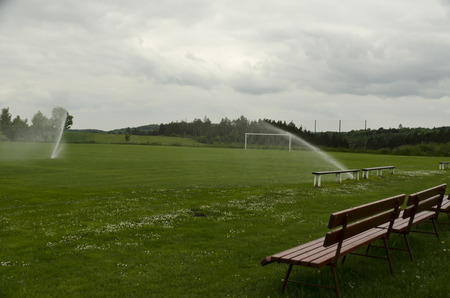 watering the football fieldの写真素材