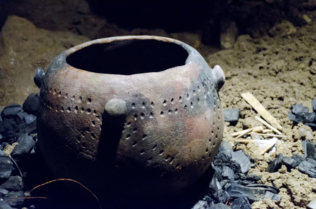 ancient stone vessel at the burned-out fireの写真素材