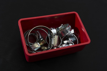 red box full of metal Ties