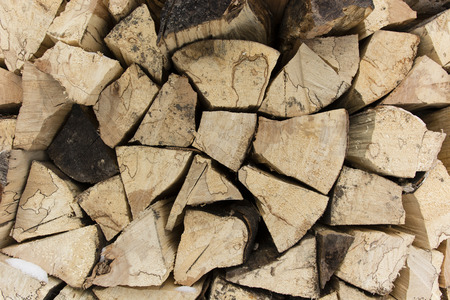 Compared pile of wooden logs