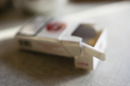 pulled out the last cigarette lying in a boxの写真素材