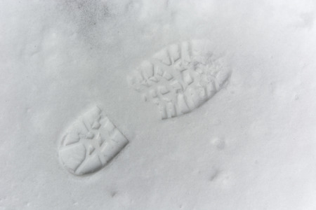 Track shoes in the snowの写真素材