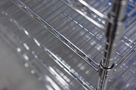metallic stainless wire shelves on the trolleyの写真素材