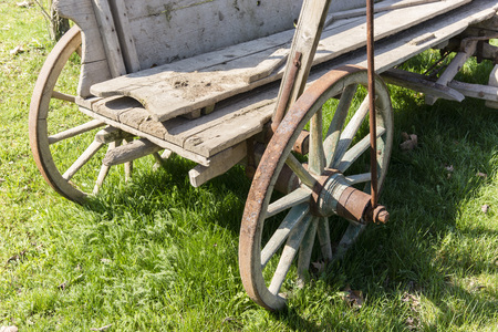 Part of a wooden wagon with wheelsの写真素材