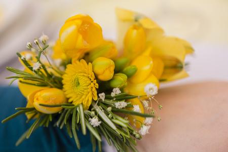 yellow flower on handの写真素材