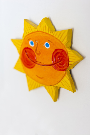 Smiling sun with red cheeks.の写真素材