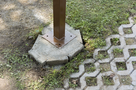 Metal leg with a concrete base.の写真素材